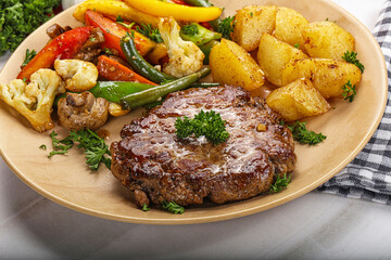 Roasted beef steak with potato