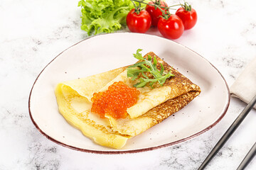 Russian pancake with red caviar