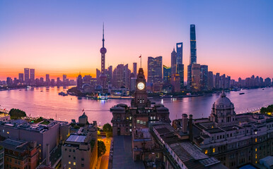 Aerial view of modern city skyline and buildings at sunrise in Shanghai