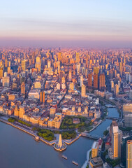 Aerial view of modern city skyline and buildings at sunrise in Shanghai