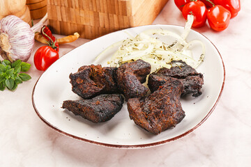 Grilled beef barbecue served onion