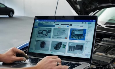 Car mechanic using laptop checking car engine part for repair, automotive industry, smart service diagnostic software concept