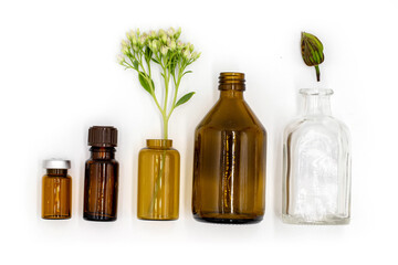 isolated on white background, colored glass bottles with essential oil and medicinal extracts, healthy lifestyle, body and health care, top view