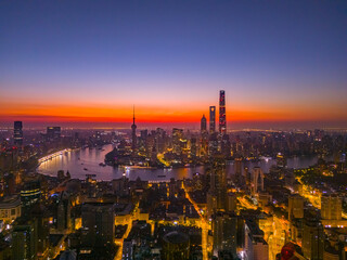 Fototapeta premium Aerial view of modern city skyline and buildings at sunrise in Shanghai
