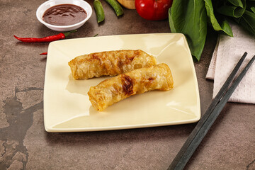 Vietnamese stuffed spring roll served sauce