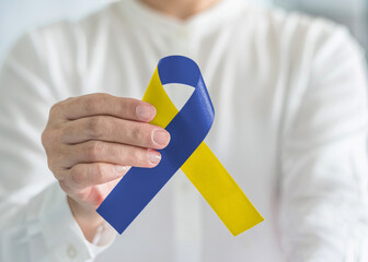 Blue yellow awareness ribbon for Down Syndrome month, Thoracic Outlet Syndrome (TOS), and flag...