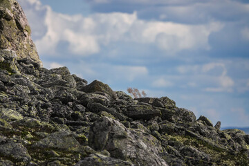 Rocks in the mountains, clouds in the sky