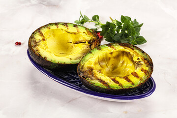 Sliced fresh avocado on the grill