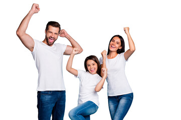 Portrait of cheerful family having brunette hair raising fists screaming yeah celebrating victory...