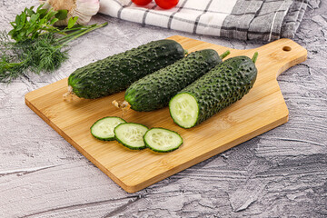 Raw green cucumbers with slices