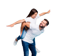 Profile side photo of cheerful people holding hands playing piggyback wearing white t-shirt denim...