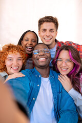 Group of students, meet on university campus work together on creative tasks, prepare for university exams, use laptop.Vertical. Education, study of university life concept.