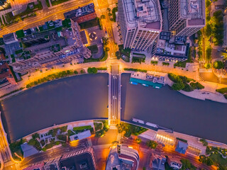 Aerial view of modern city skyline and buildings at sunrise in Shanghai