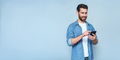 Banner portrait of handsome 30s 40s old businessman using telephone mobile cellphone. Mature...
