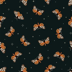 Dark pattern of garden tiger moths on dark background