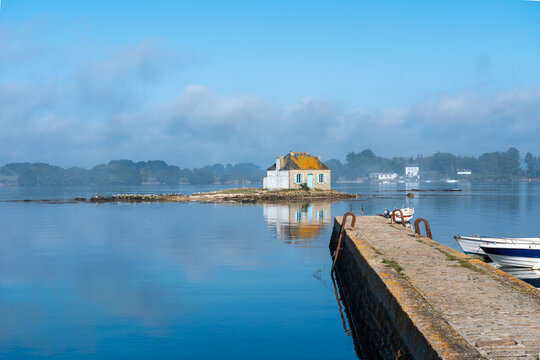 Idyllic Brittany scene with cottage on calm water, Saint Cado, Nichtarguer