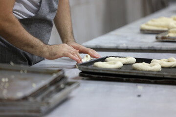 person preparing dough for baking