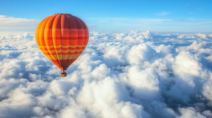 Naklejka premium An inflatable hot air balloon flies above the clouds on a sunny day