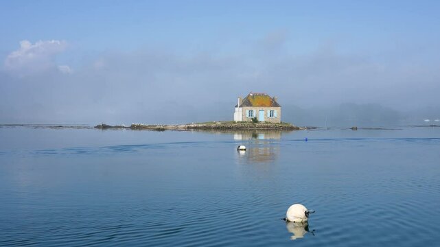 Idyllic Brittany scene with cottage on calm water, Saint Cado, Nichtarguer