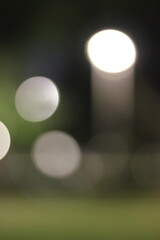 A blurry dreamy view of lights in the night.