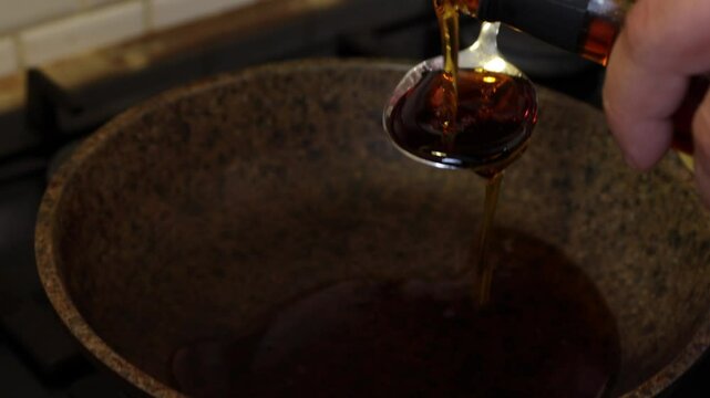 the process of caramelizing pecans in maple syrup to make pumpkin pie