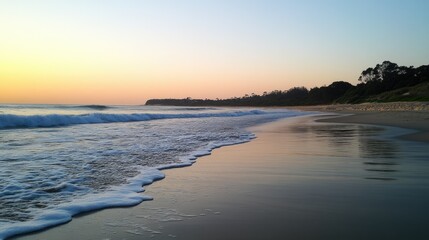 Obraz premium Tranquil Beach at Sunset with Gentle Waves