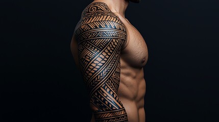 A close-up view of a muscular arm adorned with intricate tribal tattoo designs showcasing artistry and cultural heritage.
