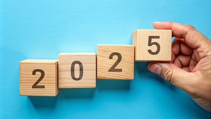 Wooden cubes with the numbers 2025, symbolizing the transition to a new year and new beginnings. Perfect for concepts of change, progress and future goals.