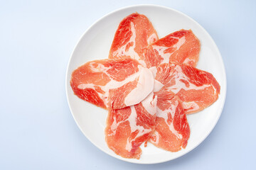 Freshly Sliced Meat Arranged on White Plate