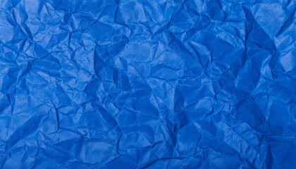 Obraz premium Crumpled blue paper background. Creative abstract texture for your design.