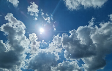 It is a blue sky with the sun shining.