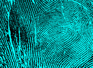 Index fingerprint with ultraviolet lamp as background, top view.