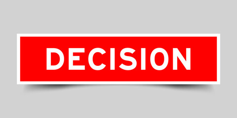 Red color square shape sticker label with word decision on gray background