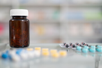 Close-up view of pill bottles and pill sorting tray