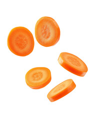 Flying carrot slices create a playful scene of healthy snacking in mid-air