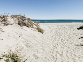 Beach with white sand dunes. 