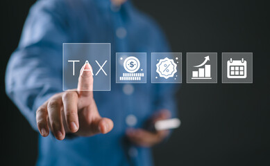 TAX calculation concept. Businessman touching tax icon on virtual screen, calculating finance, accounting, statistics and data analytic research, income tax return and submit for payment tax.