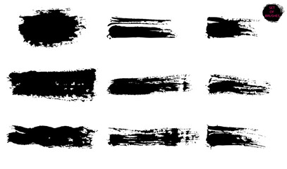 Textural brush strokes. A set of black paint strokes created for decoration, isolated on a white background.
