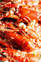 plate of traditional garlicky spicy sichuan red crawfish