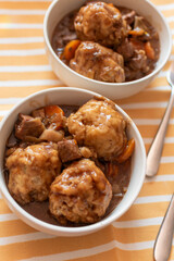 bowls of home made beef stew and dumplings English British food, comfort food, winter meal 