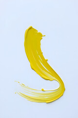 Abstract yellow brush strokes on white background, creating a bold and dynamic visual effect.