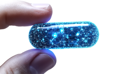 Digital representation of a futuristic capsule held between fingers isolate on transparent background, png, cutout