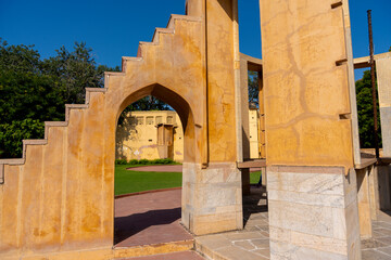 A close-up of an ancient astronomical instrument at Jaipur’s Jantar Mantar, showcasing intricate architecture and scientific precision in time measurement.