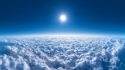 A panoramic view above the clouds, deep blue sky