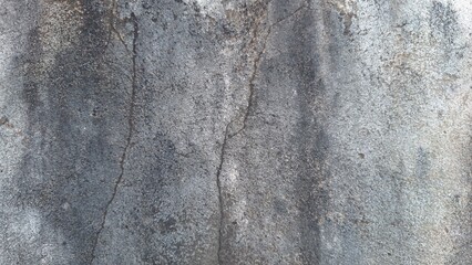 Old wall with mold, mildew, dark fungi, and cracks