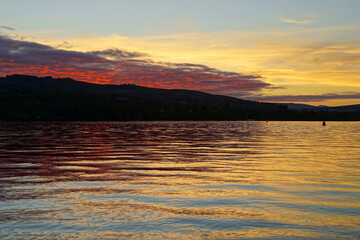 View over Loch Lomond from Balloch during sunset. It is part of the Loch Lomond and The Trossachs National Park 