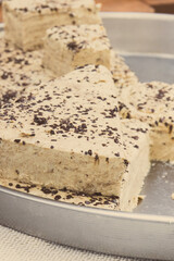 Halva with vanilla and chocolate on stall at bazaar. High calorie snack