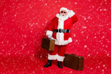 Full length body size view of his he amazed speechless funky fat overweight plump gray-haired bearded man tourist carrying bag isolated over bright vivid shine red background