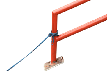 An old rope is tied to a red iron pole isolated on transparent background.