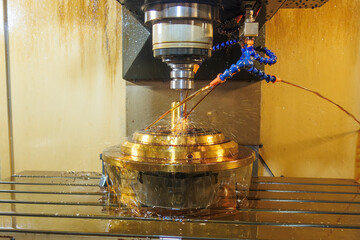 The CNC milling machine cutting the shell mold parts with oil coolant method.
